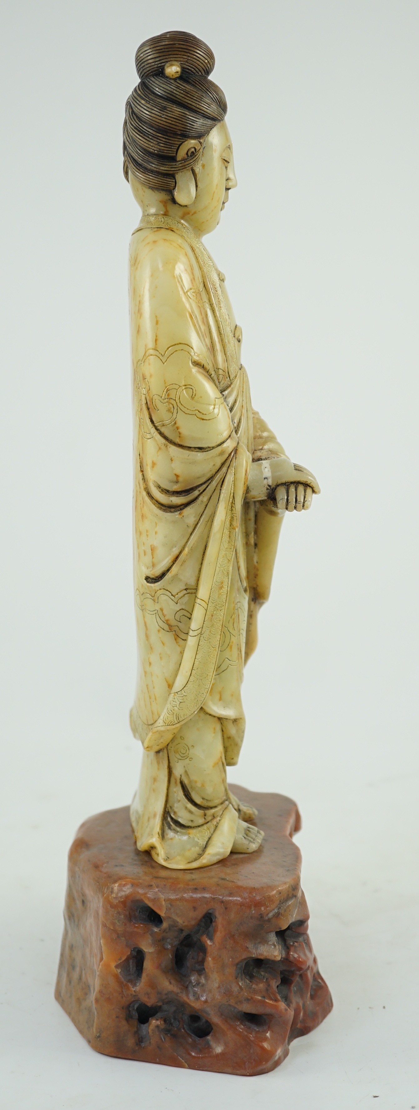 A Chinese soapstone standing figure of Guanyin, 19th century, 38cm high